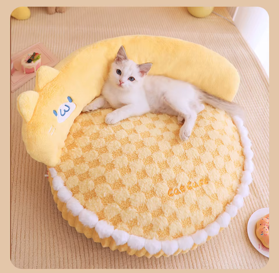 Kitten on plush mango yellow cat bed