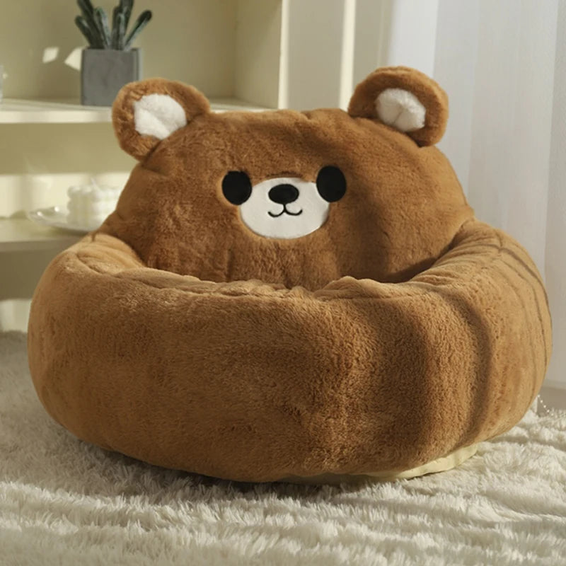 Brown bear-shaped cat bed in a room setting.