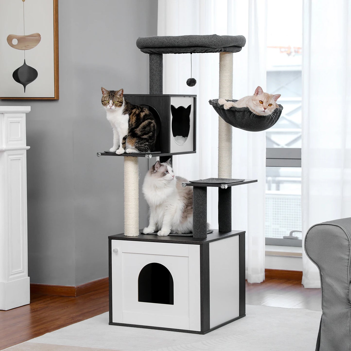Cat tree with multiple levels and a hammock in a living room setting.