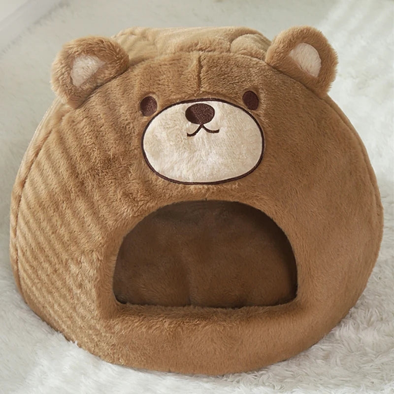 Brown bear-shaped pet bed on a white surface