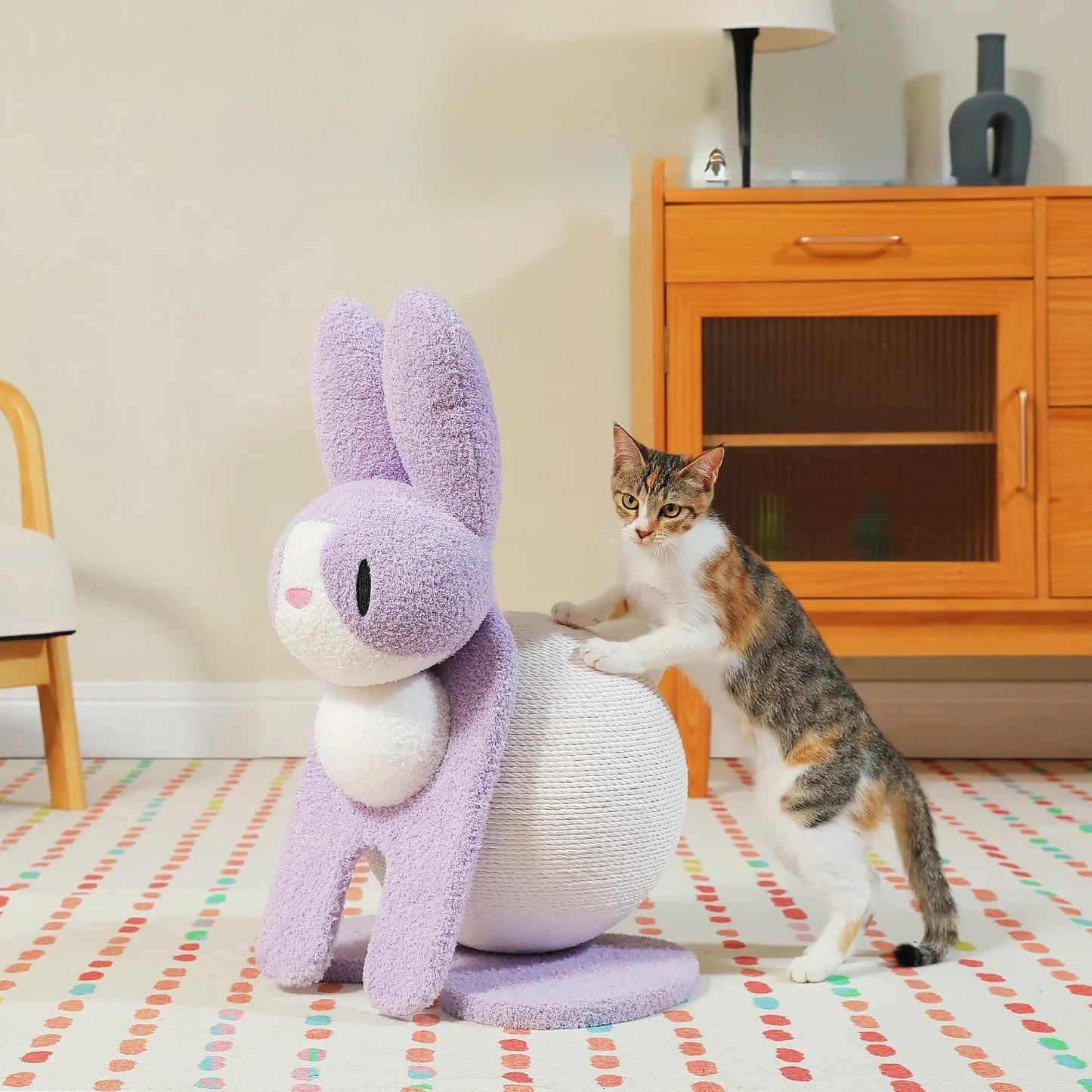 Cat interacting with a cat scratching post in a room with wooden furniture and a lamp.
