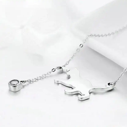Detail image of silver colored cat-shaped necklace with cubic zirconia