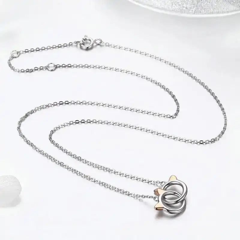Silver necklace with a unique pendant on a white background