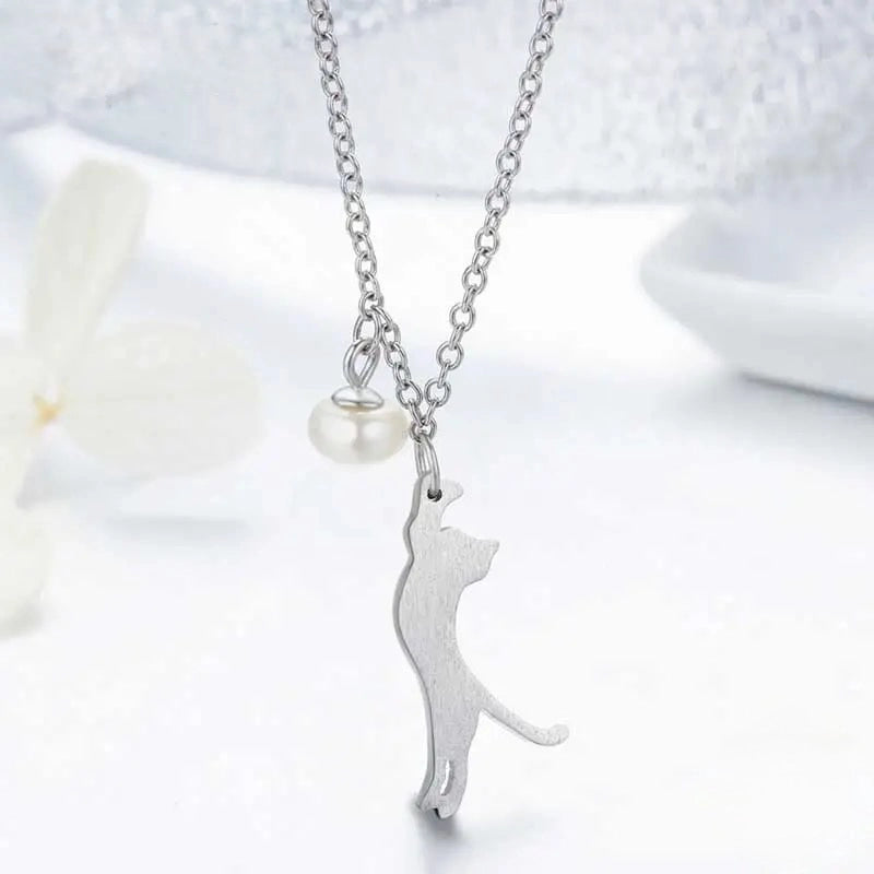Silver necklace with a cat-shaped pendant on a white background