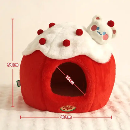 Red pet bed shaped like a cake with measurements on a light pink background