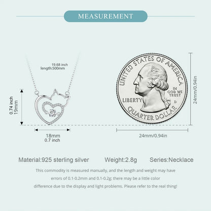 Measurement chart of a silver necklace with heart design and a quarter dollar coin, showing dimensions and material details.