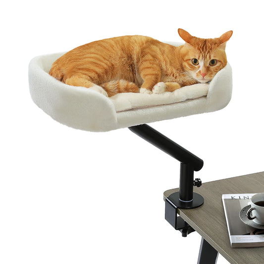 Cat lounging on a adjustable cat perch attached to a table.
