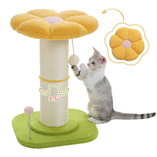 Cat playing with a flower-shaped cat scratching tree and toy on a white background
