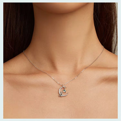 Necklace with a moon and star pendant on a model's neck