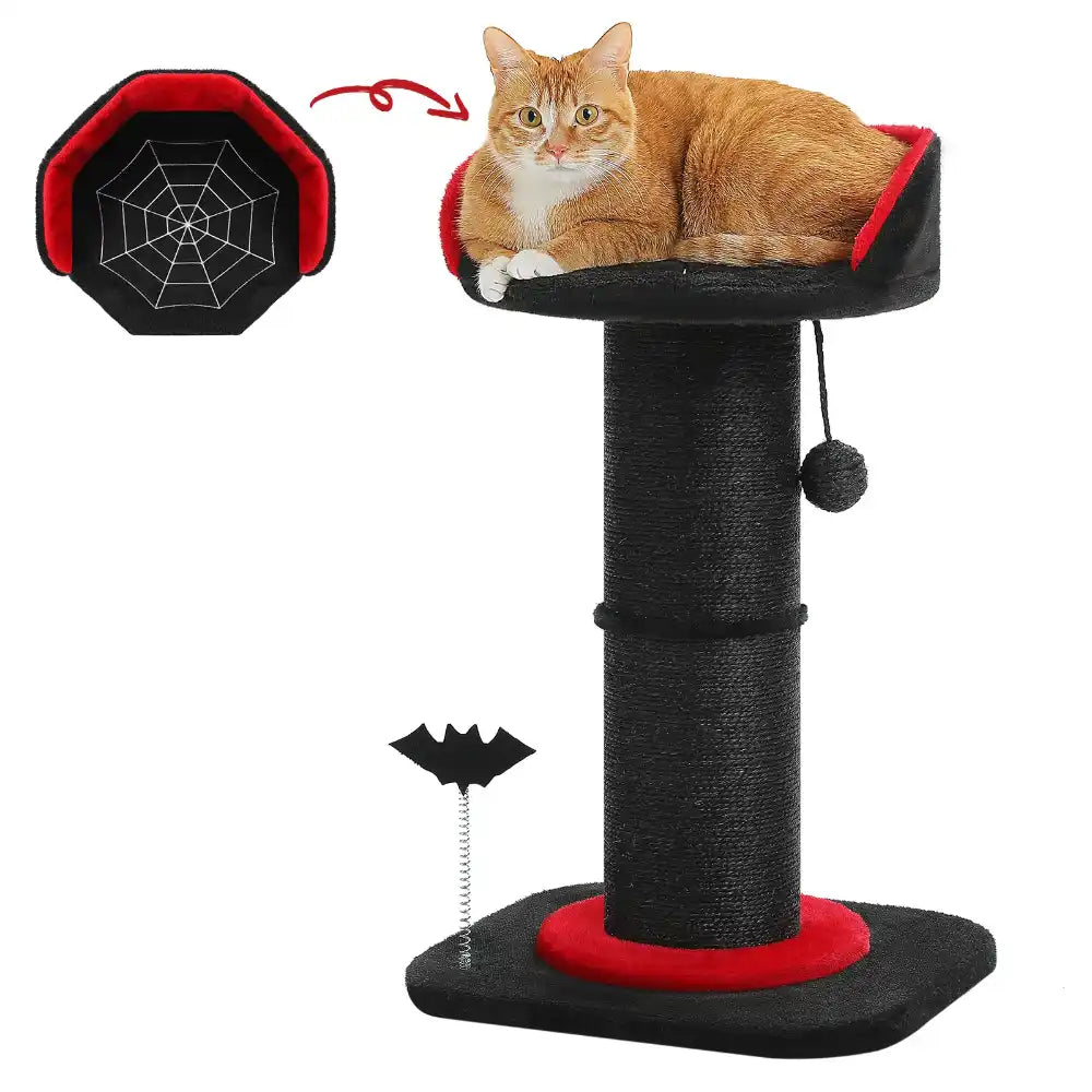 Cat sitting on a black and red cat tree with a spider web detail and a bat-shaped toy.