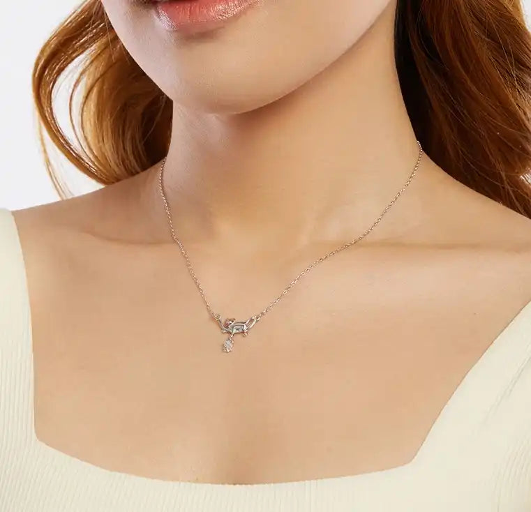 Necklace with a pendant worn by a person on a white background