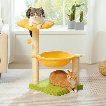 Two cats on a multi-level cat tree with yellow platforms and green base in a bright room.