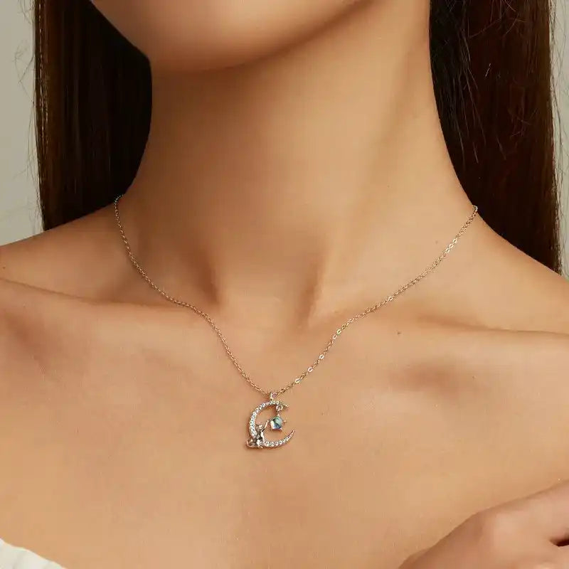Cat and moon necklace on model