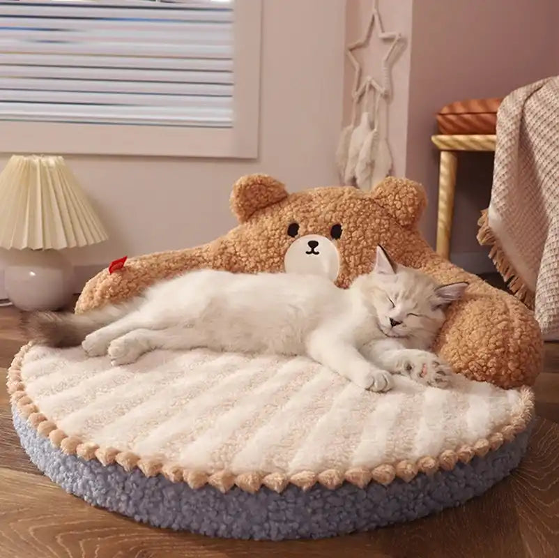 Cat lying on a fluffy teddy bear-themed pet bed in a cozy room.