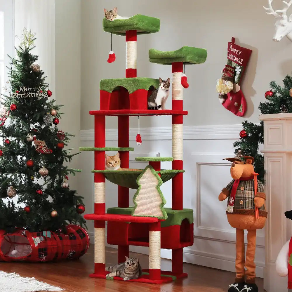 Cat tree with multiple levels and green and red accents in a festive room with Christmas decorations.