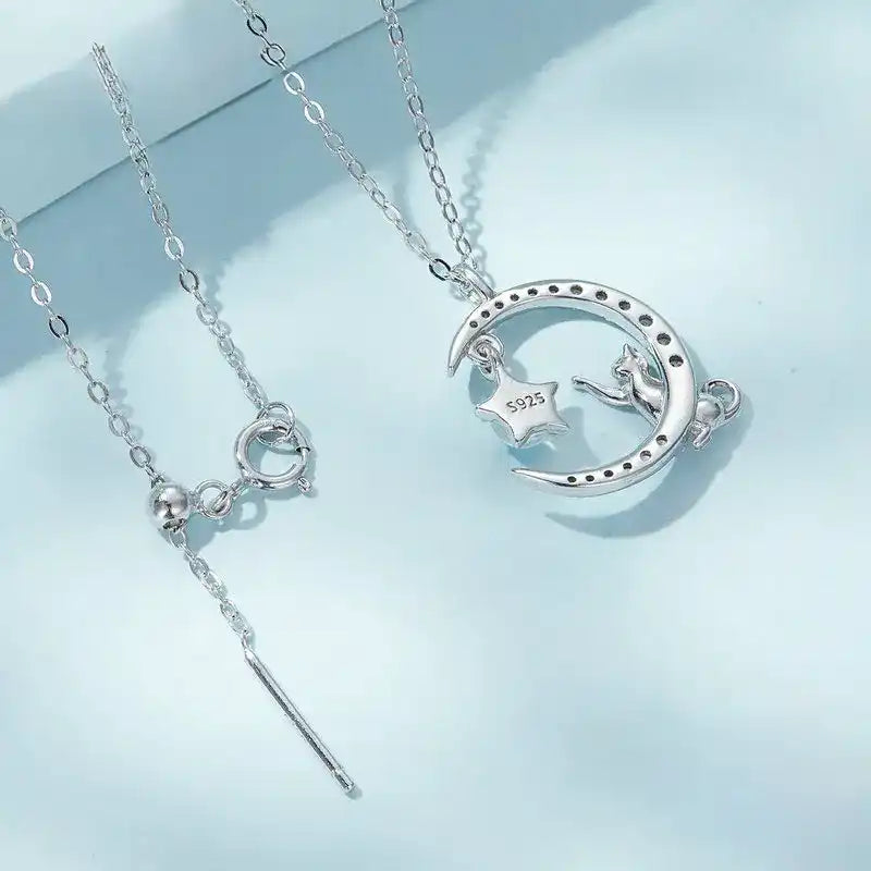 Detail image of cat and moon necklace showing silver stamp mark and closure