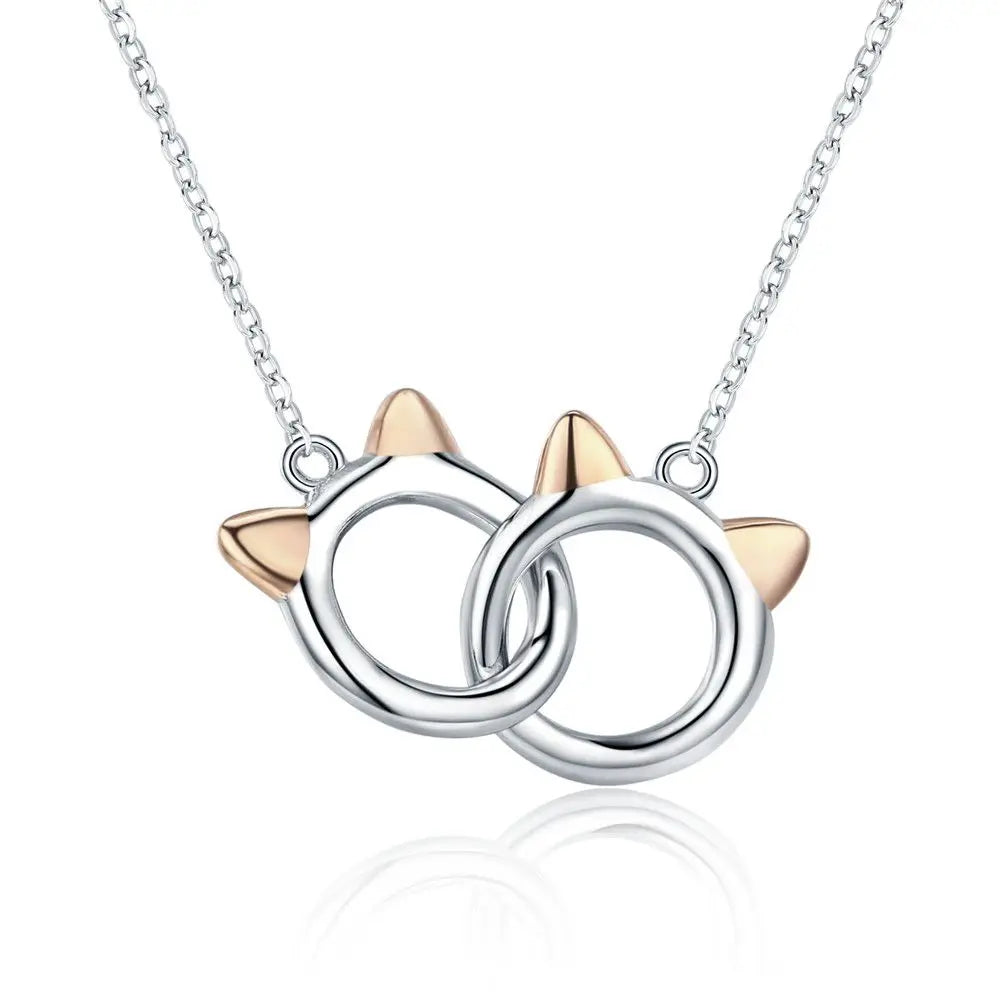 Necklace with cat ear pendants on a white background