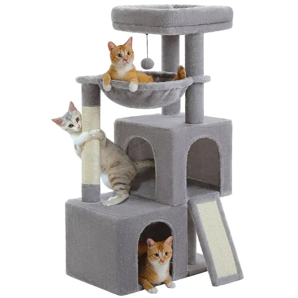 Gray cat tree with two condos and three cats playing on it