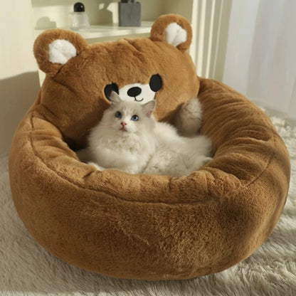 cat laying within a bear-shaped plush donut cat bed