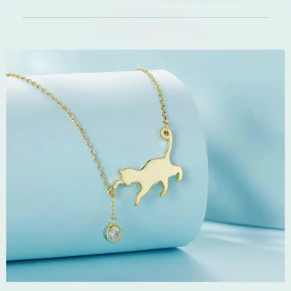 Gold-plated cat-shaped necklace with cubic zirconia. 