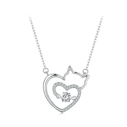 Silver necklace with a heart and cat design on a white background