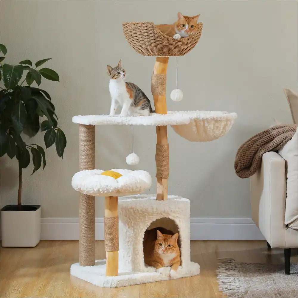 Cat tree with multiple levels and a basket, featuring three cats in a home setting.