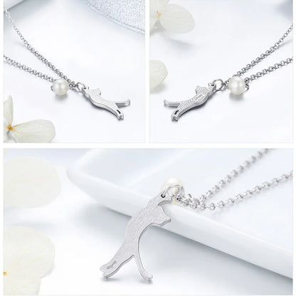 Silver necklace with a cat pendant on a white background