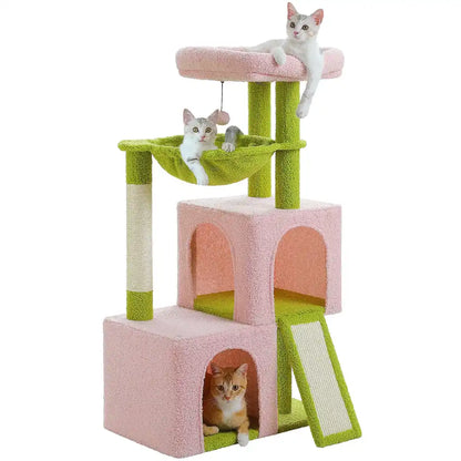 Three cats playing on a pink and green cat tree with two condos, a perch and hammock