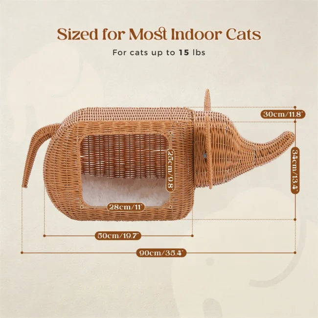 woven wicker elephant-shaped cat bed with interior cushion shown with dimensions on pale background