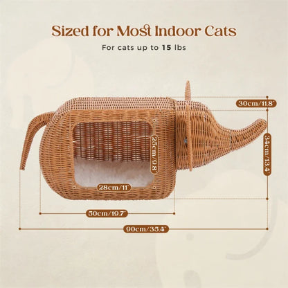 woven wicker elephant-shaped cat bed with interior cushion shown with dimensions on pale background