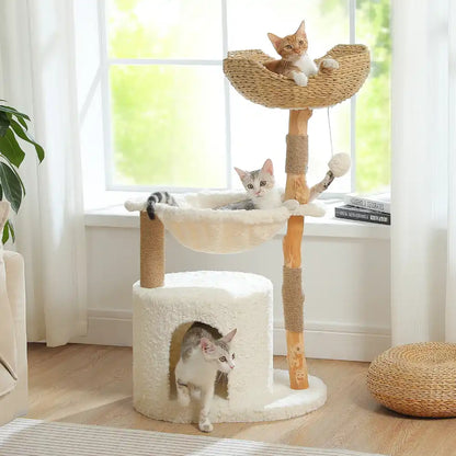 Cat tree with hammock and condo in living room setting with three cats