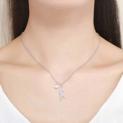 Necklace with a cat pendant on a model's neck