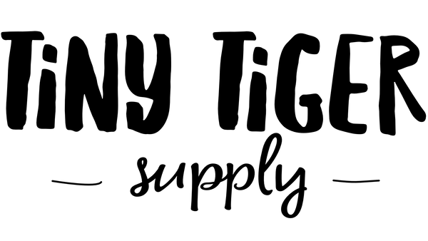 Black text logo on white. Text says "Tiny Tiger Supply"